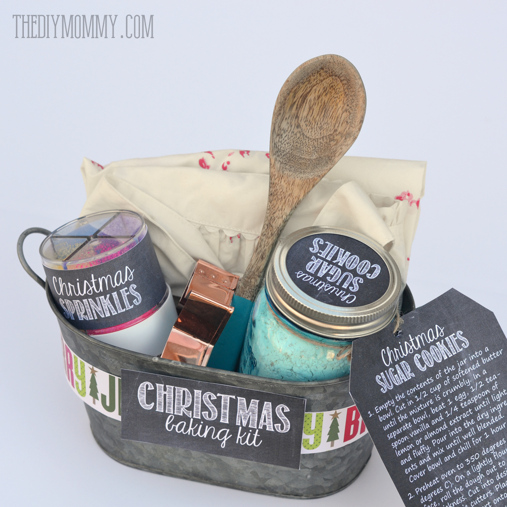 Gift basket idea: A Christmas Baking Kit in a Tin! Put sprinkles, cookie mix, a cookie cutter, a wooden spoon and an apron in a pretty tin for a great gift idea. Comes with free printable labels and tags!