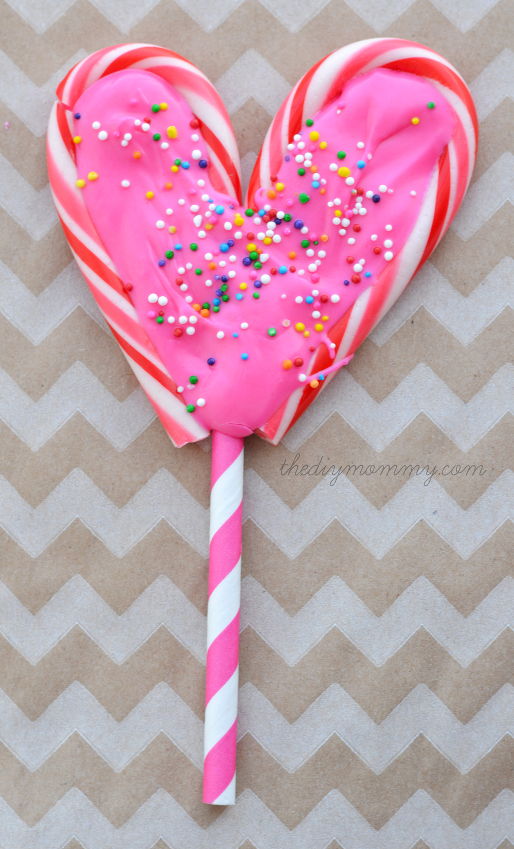 Make Candy Cane Heart Lollipops by The DIY Mommy