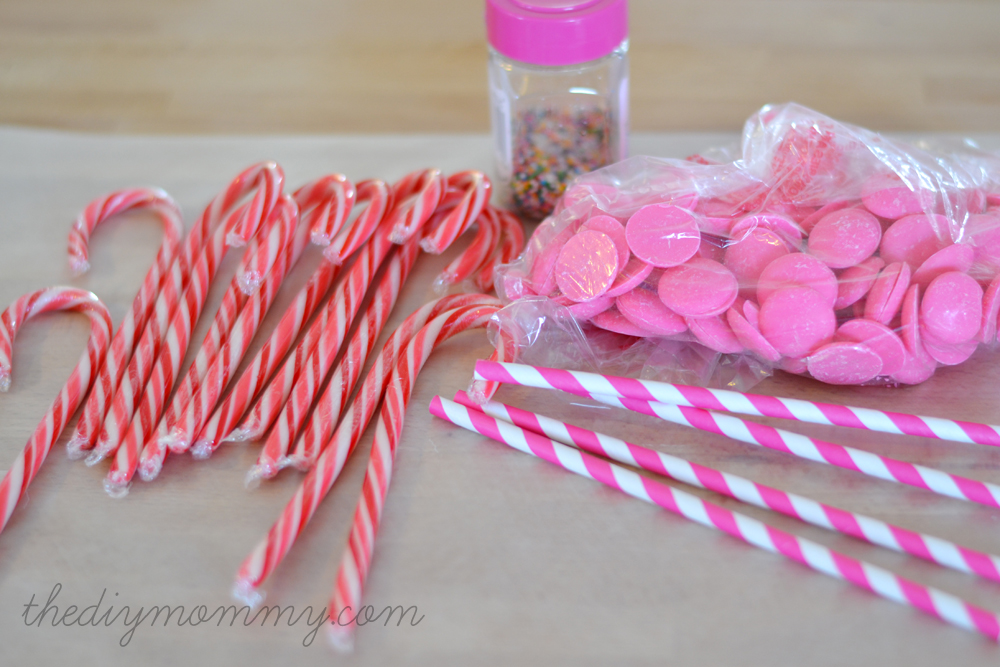 Make Candy Cane Heart Lollipops by The DIY Mommy