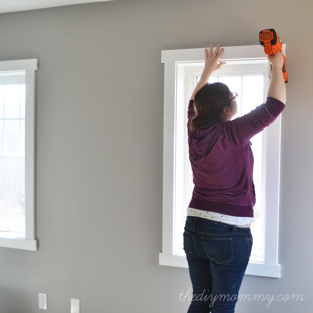 installing the top piece of craftsman style window trim