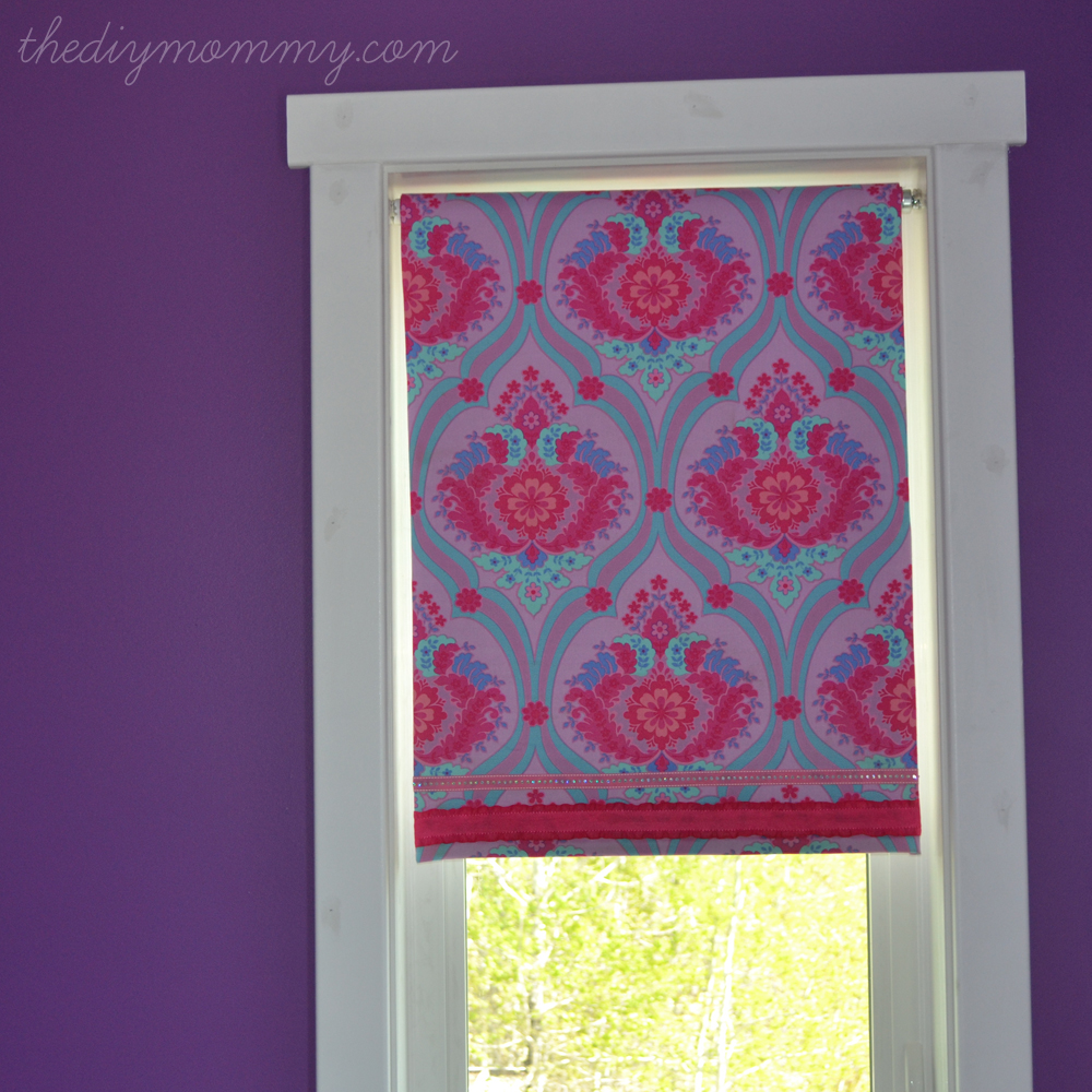 DIY No-Sew Fabric Covered Blackout Roller Blinds by The DIY Mommy. Just use spray adhesive, fabric and ribbon for an exciting update to your roller blinds!