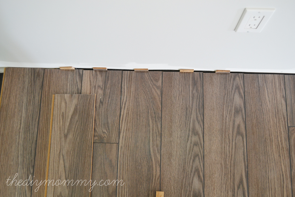 Installing Our Laminate Flooring - Our DIY House | The DIY Mommy