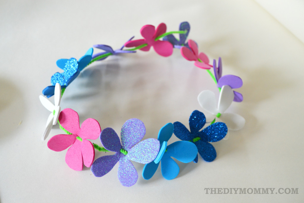 Make a floral crown from foam sheets, pipe cleaners and ribbon. The DIY Mommy.