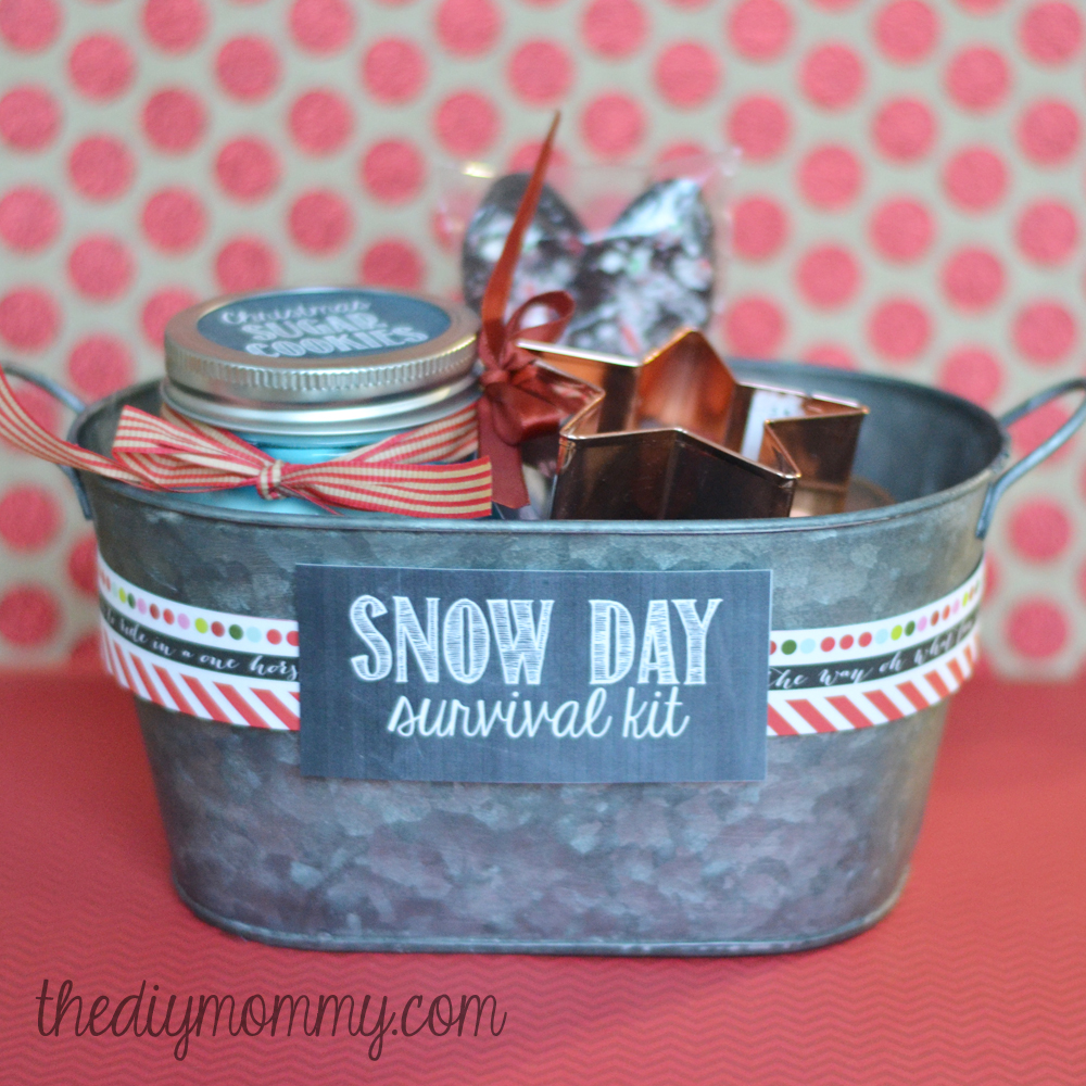 DIY Snow Day Survival Kit Christmas Gift - sugar cookies in a jar, a cookie cutter, hot chocolate mix in a jar, and hot chocolate spoons!