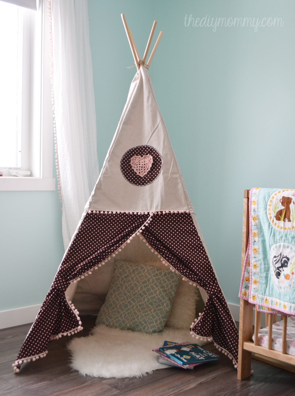 DIY teepee play tent in a toddler's room.