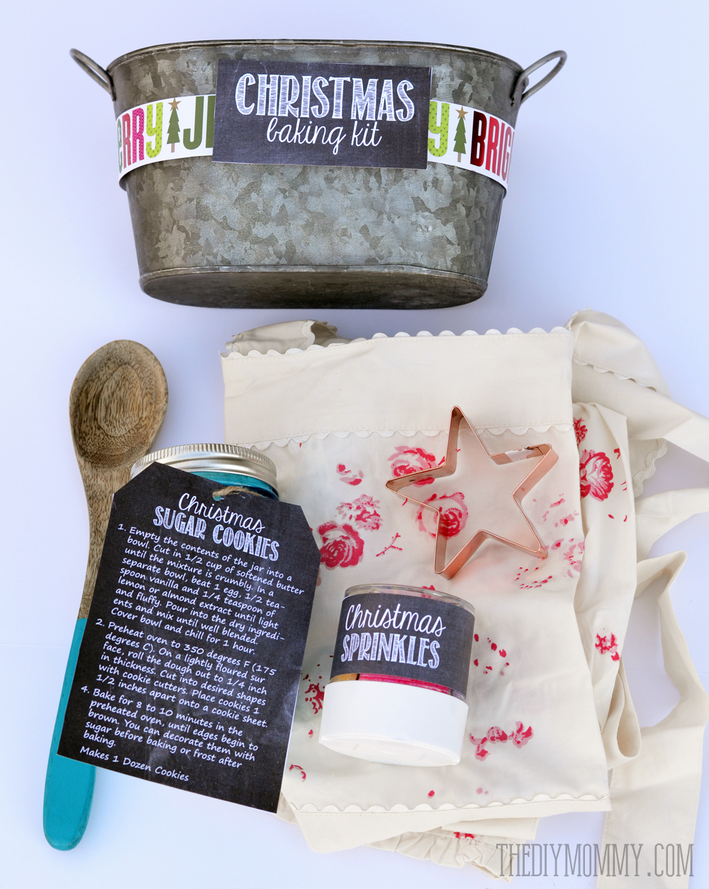 Gift basket idea: A Christmas Baking Kit in a Tin! Put sprinkles, cookie mix, a cookie cutter, a wooden spoon and an apron in a pretty tin for a great gift idea. Comes with free printable labels and tags!