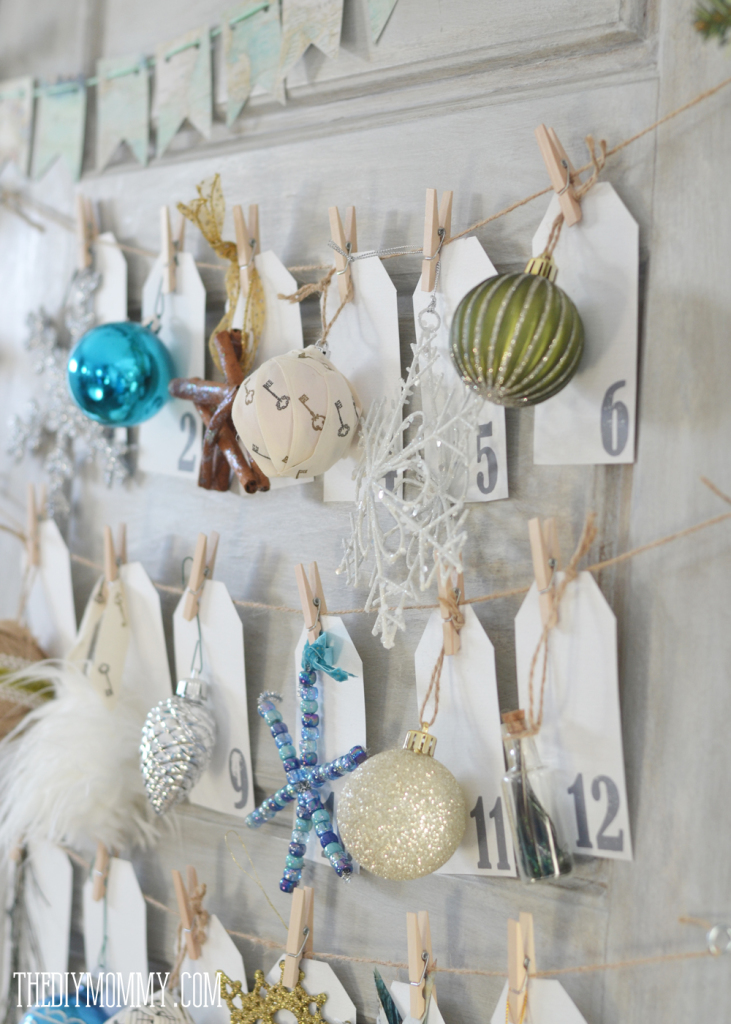 A DIY Christmas ornament advent calendar made from an old door