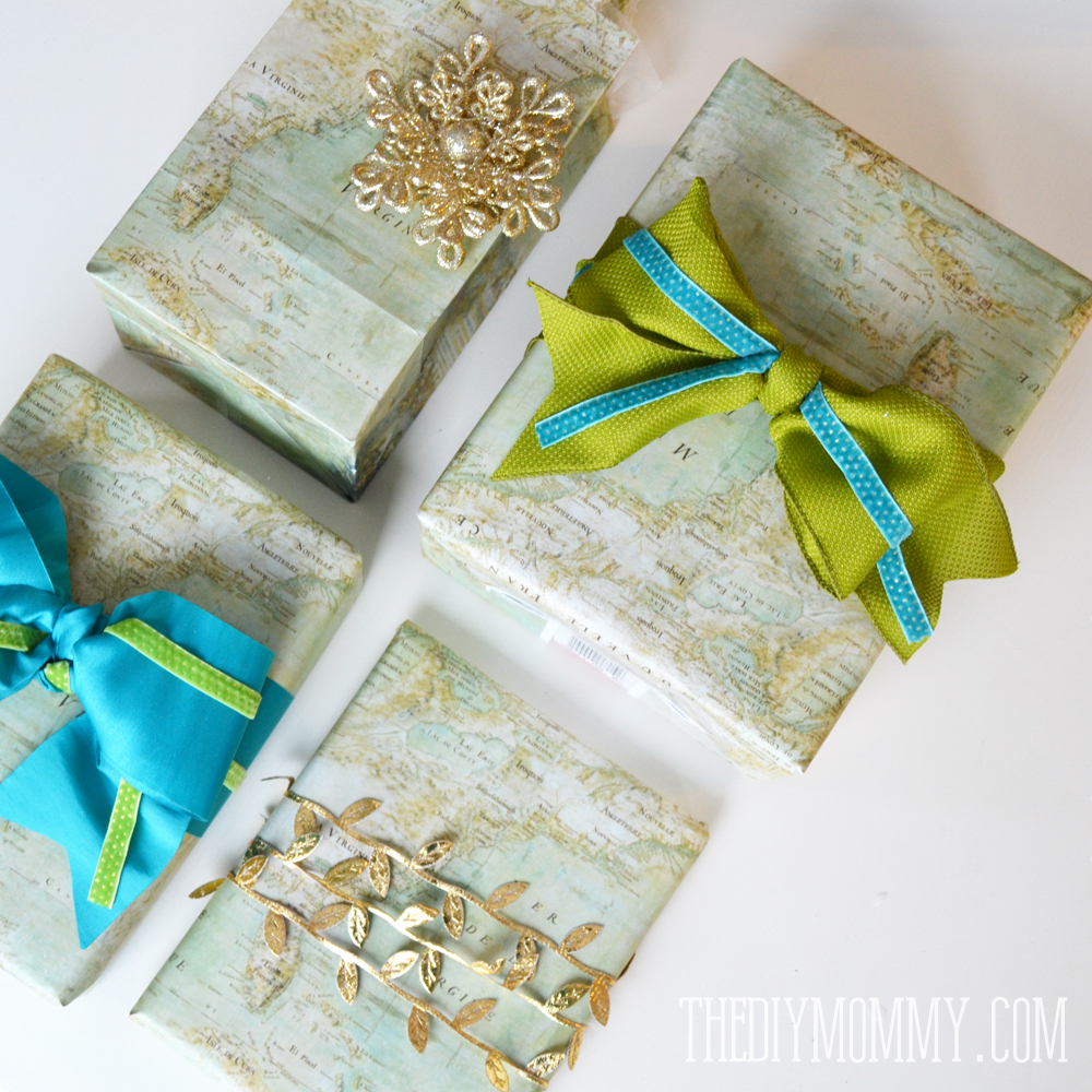 Wrap Christmas presents in vintage maps that you find or print, and accent them with green, teal and gold ribbon