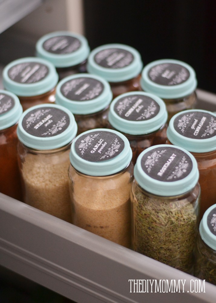 This spice organization idea costs zero dollars and it's so cute - recycle some baby food jars, paint the lids, and stick on some free farmhouse styled labels!
