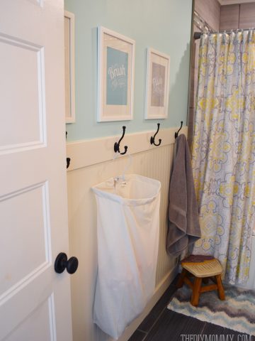 How to install an easy DIY beadboard hook wall in a bathroom. It's pretty and practical!