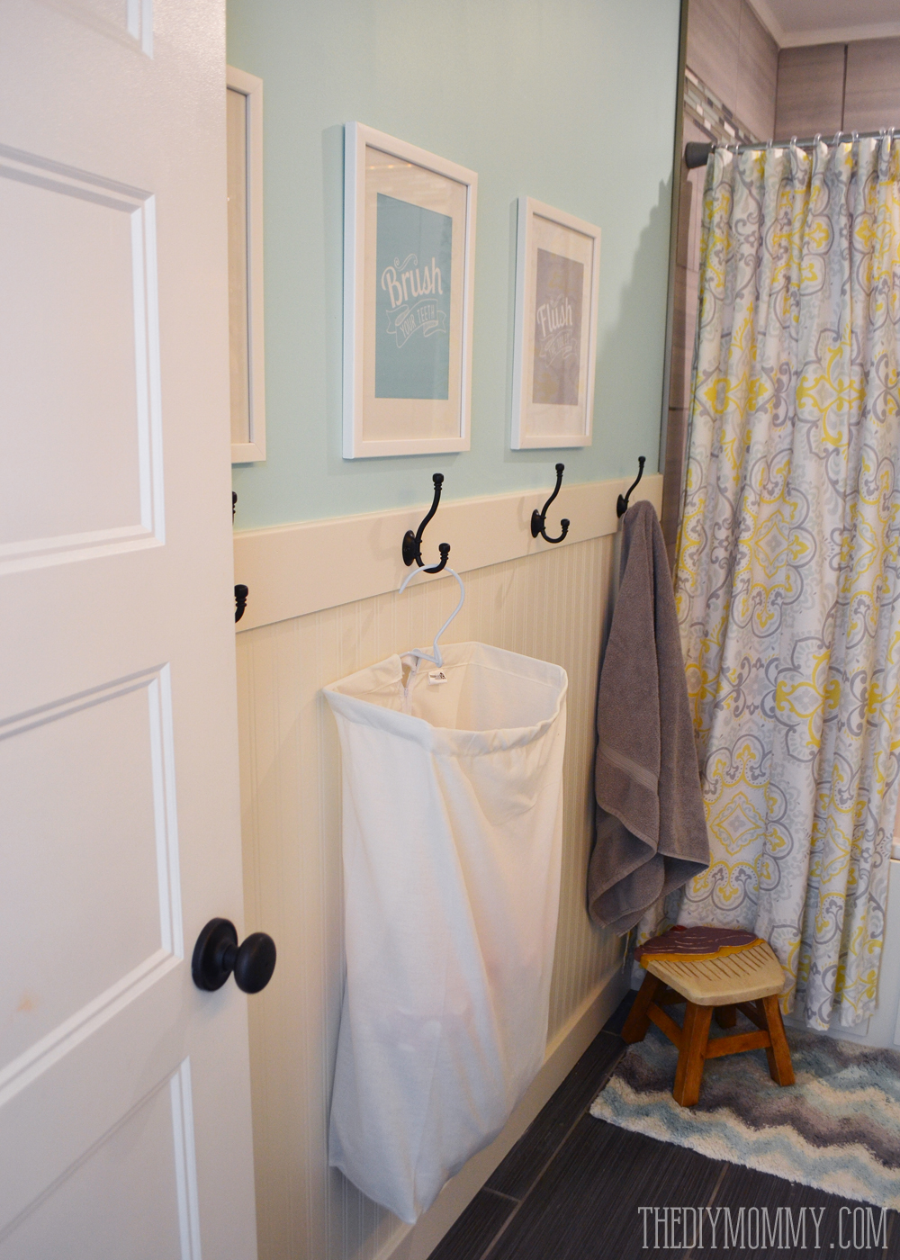 How to install an easy DIY beadboard hook wall in a bathroom. It's pretty and practical!