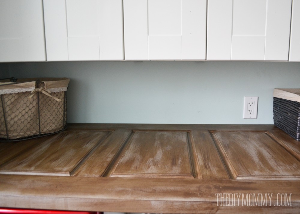 How to make a laundry room counter top from a door; such a unique countertop idea!