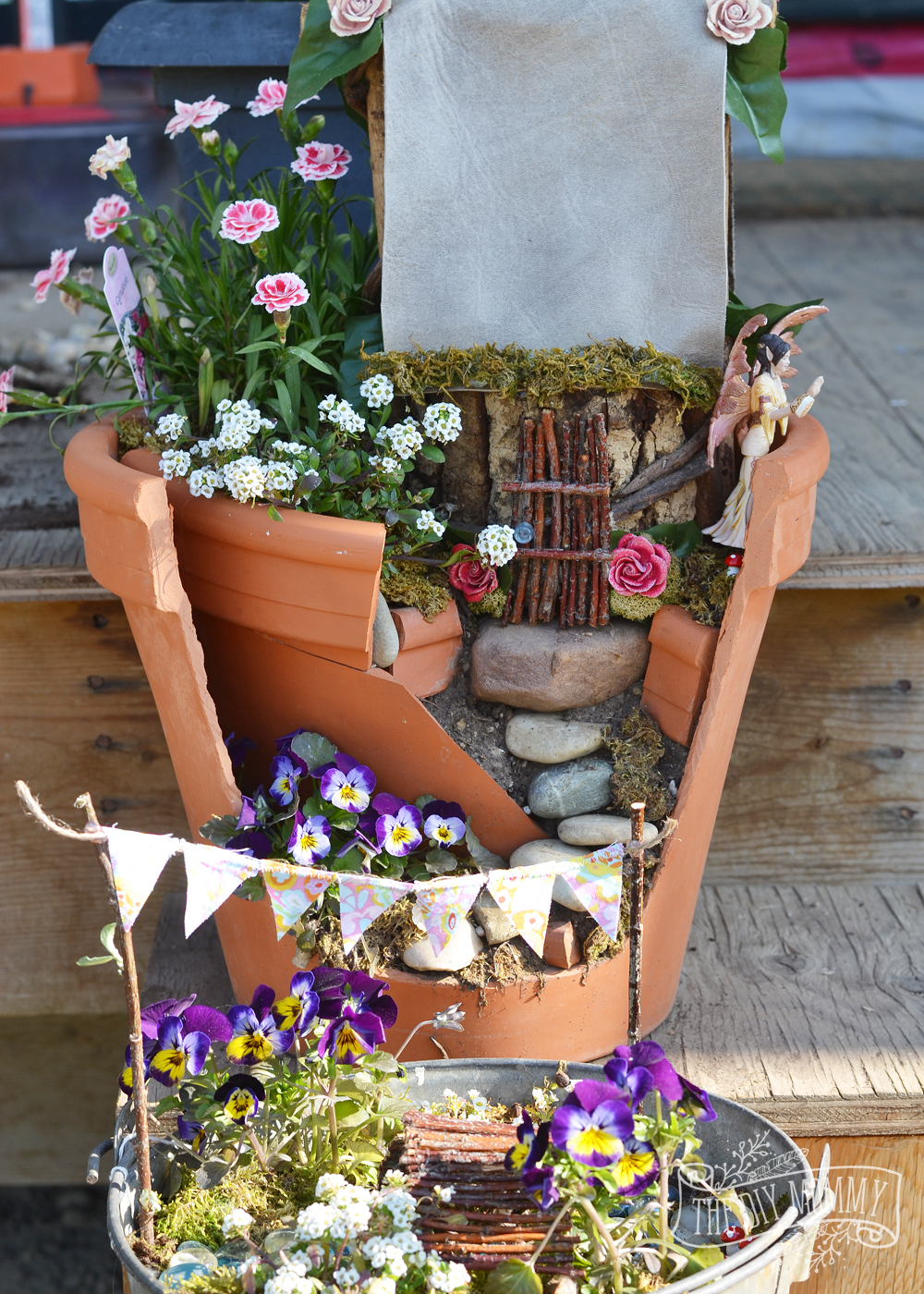 Easy + Inexpensive Fairy Garden: A broken pot, some props made of sticks, and some imagination make a sweet potted fairy garden that doesn't break the bank!