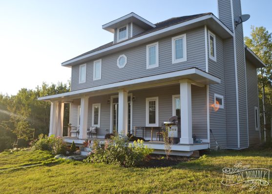 DIY Craftsman Foursquare Home with Grey Siding, Porch with DIY Columns and a Dark Teal Door