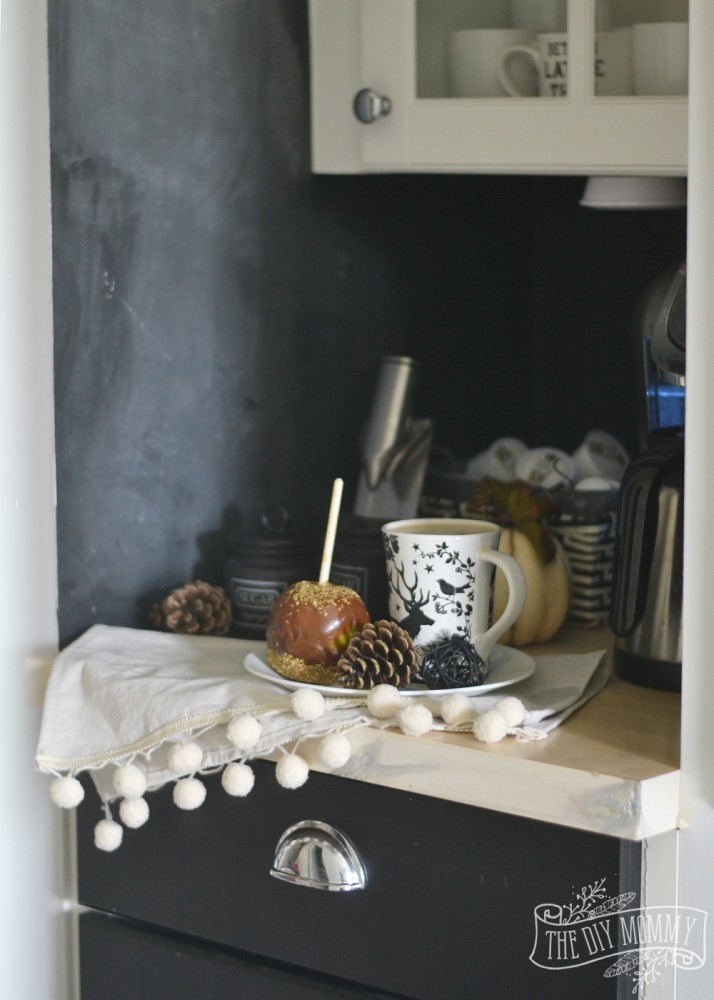 Fall coffee nook with pom pom napkin, caramel apple, chalkboard wall