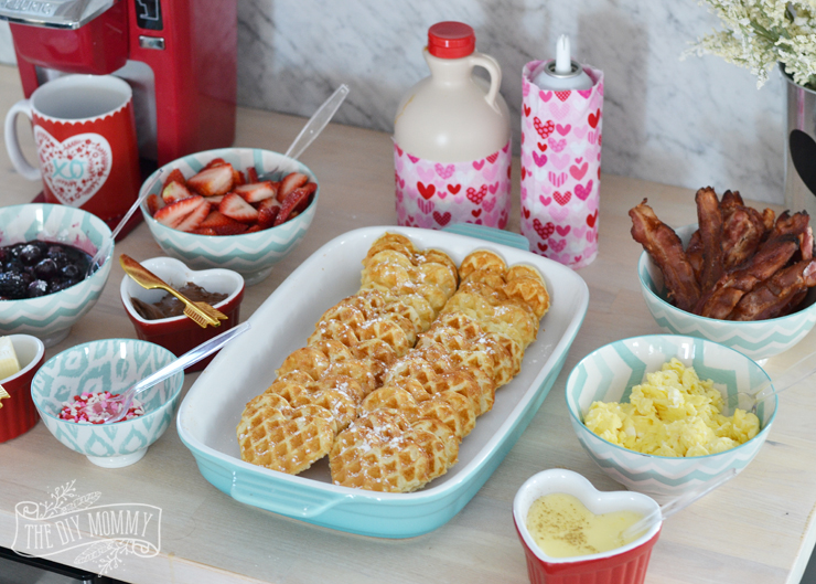 Valentine's Day Waffle Bar - it's such a sweet idea! Make heart shaped waffles and serve with a variety of sweet and savory toppings.