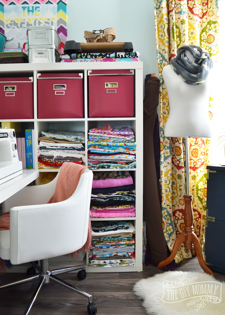 A colorful boho craft room home office with tons of great DIY decor and organization ideas.