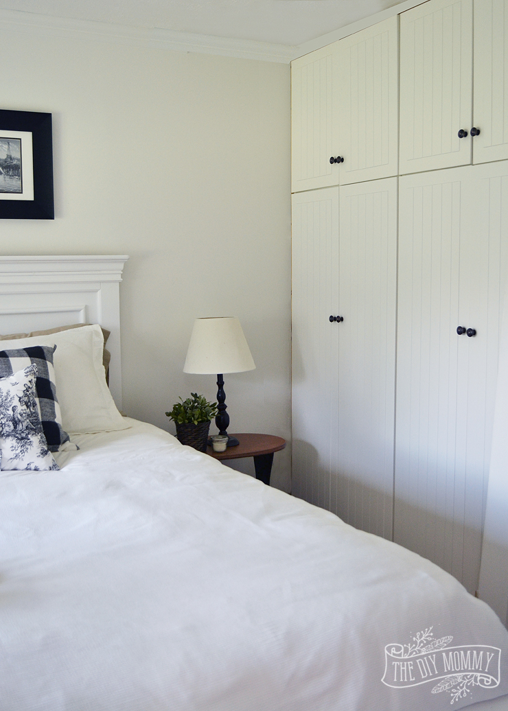 A black and white farmhouse cottage bedroom design with buffalo plaid & toile