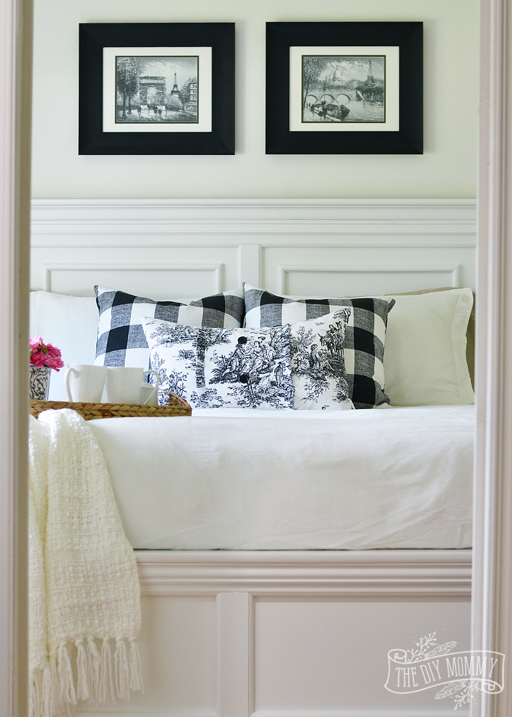 A black and white farmhouse cottage bedroom design with buffalo plaid & toile