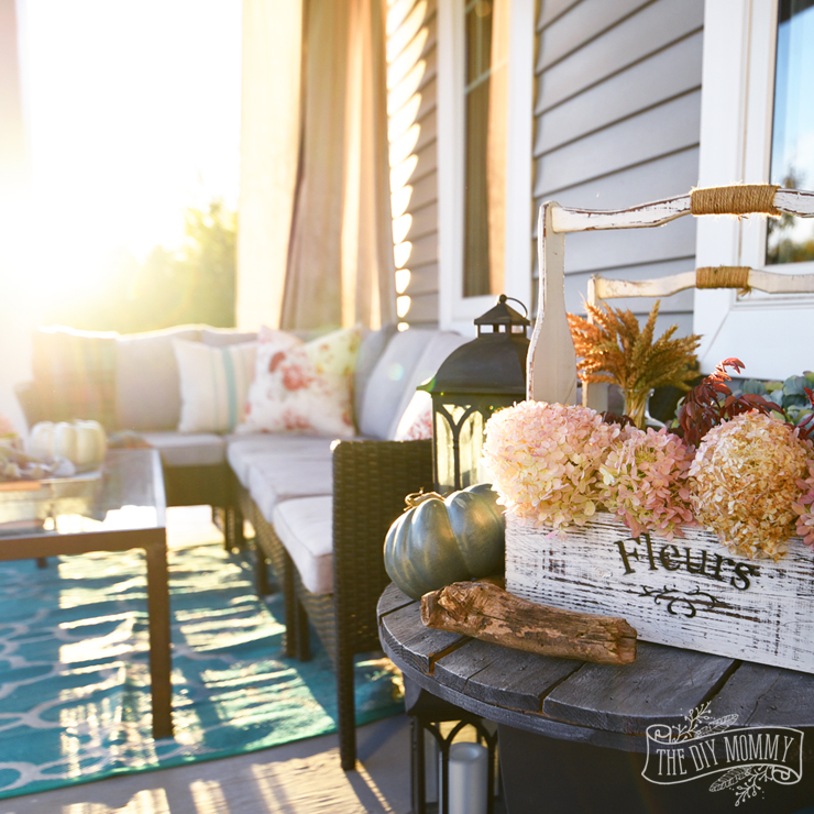 Colorful country boho farmhouse porch decor for Fall in pinks, reds, teals and grays