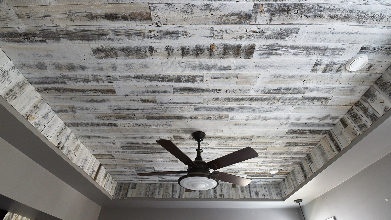 A DIY rustic wood ceiling with white reclaimed Stikwood