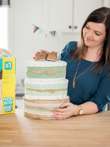 Learn how to make a diaper cake - this one is so cute and rustic with NO diaper rolling!