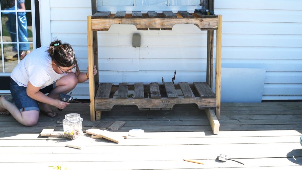 How to make a DIY potting bench out of old pallets, reclaimed wood and an antique window