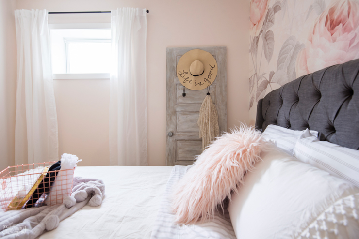 Feminine Modern Farmhouse Guest Bedroom Makeover with large floral wall mural, upholstered headboard, and blush pink, grey and copper colors