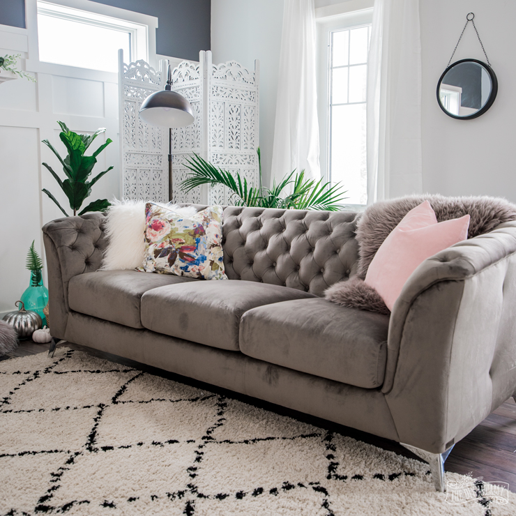 How to style a grey tufted velvet couch