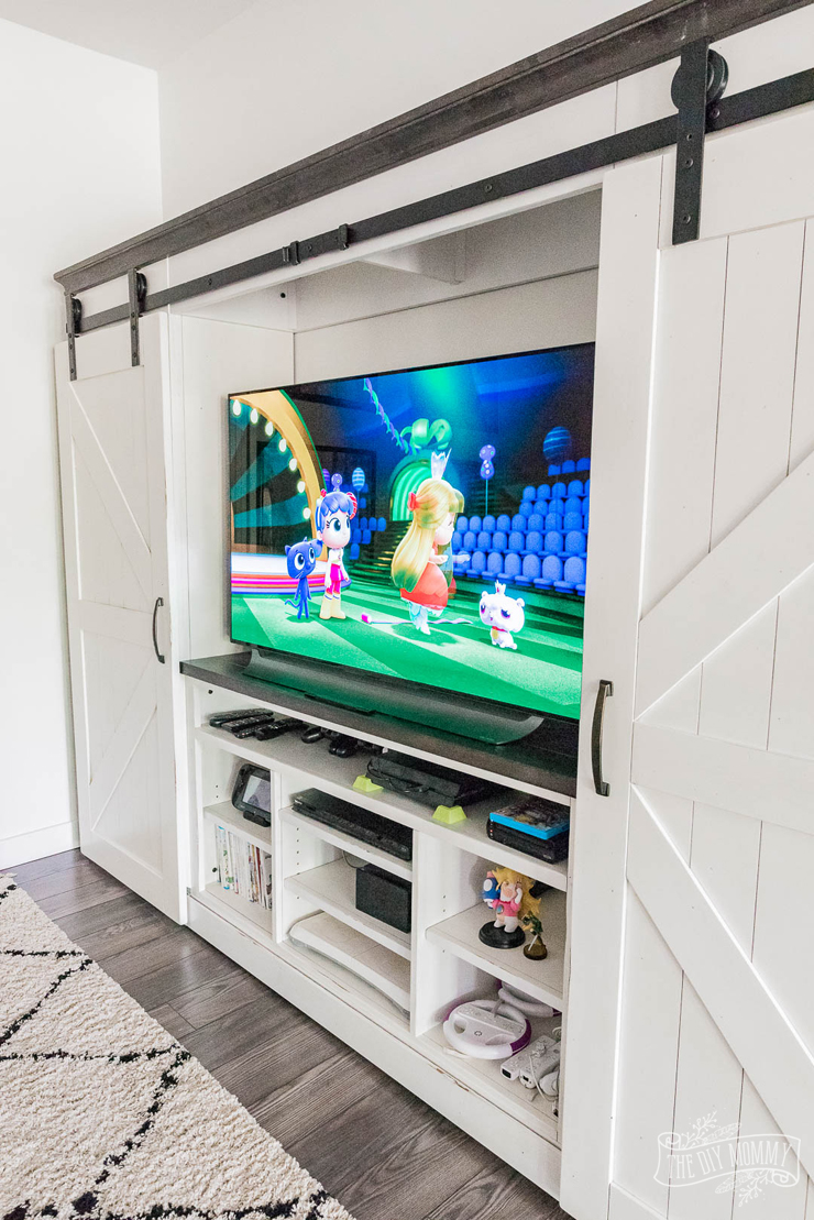 Beautiful and practical basement TV play room in a modern farmhouse style with tons of storage and DIY ideas