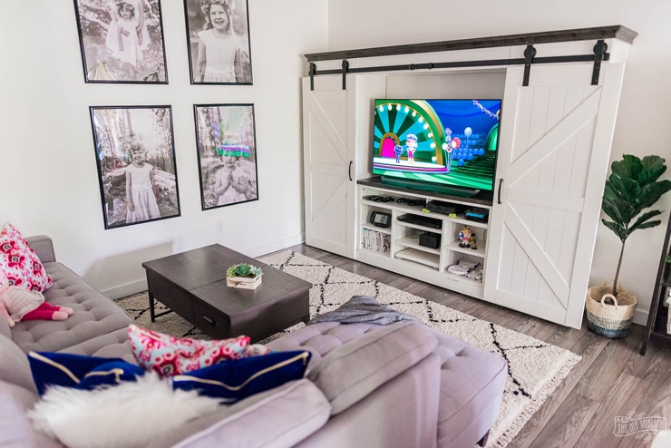 Beautiful and practical basement TV play room in a modern farmhouse style with tons of storage and DIY ideas