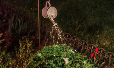DIY faux enamelware watering can light feature for garden