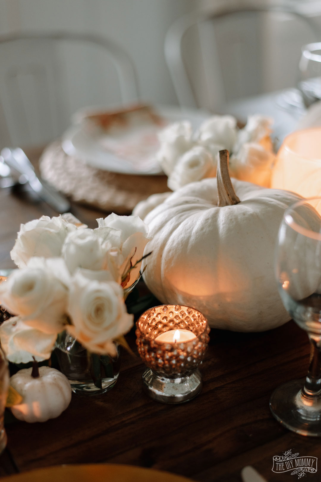 Elegant, romantic Thanksgiving tablescape idea for 12 in whites, creams and a mix and match style