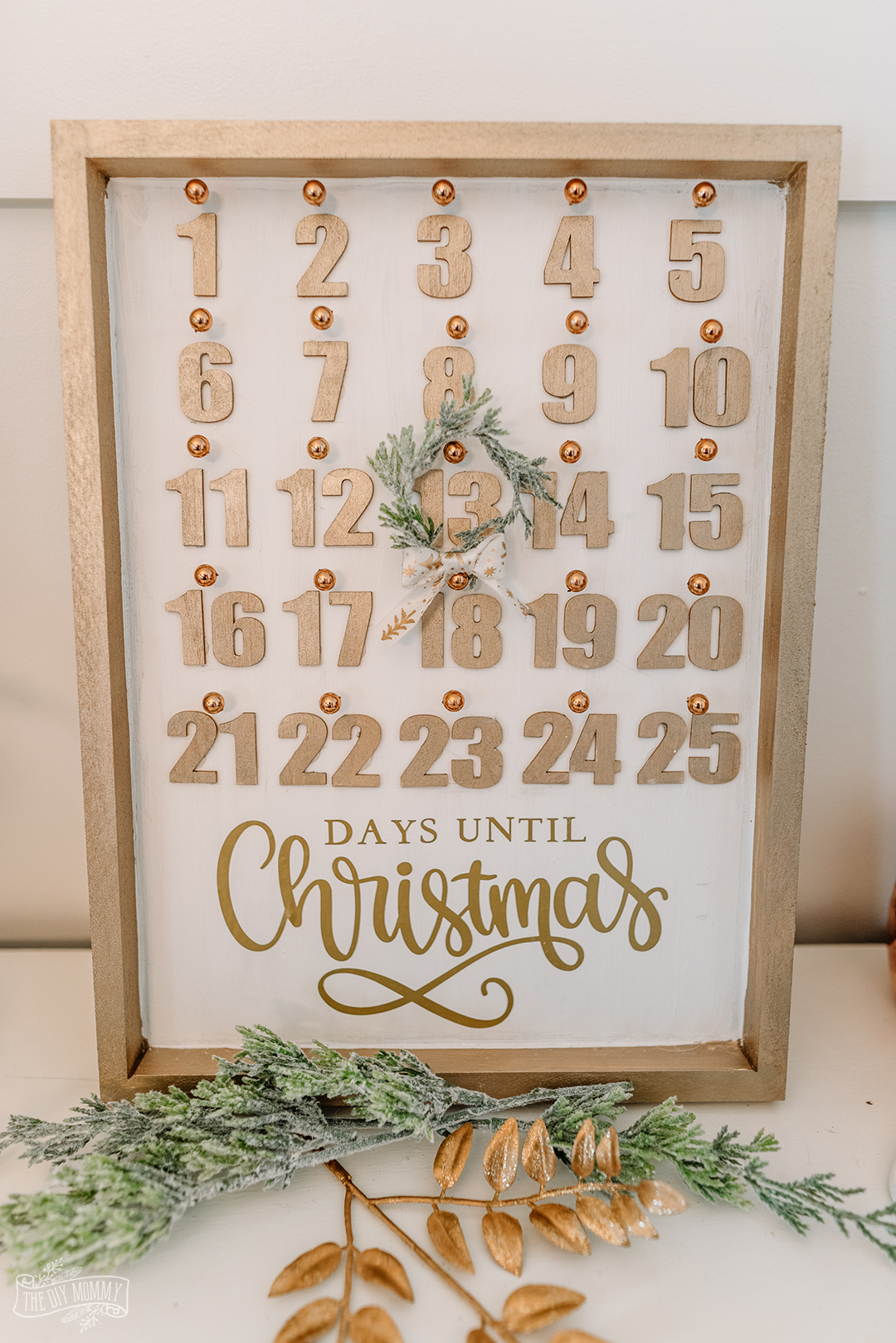 Learn how to make a beautiful DIY Christmas countdown calendar with dollar store supplies