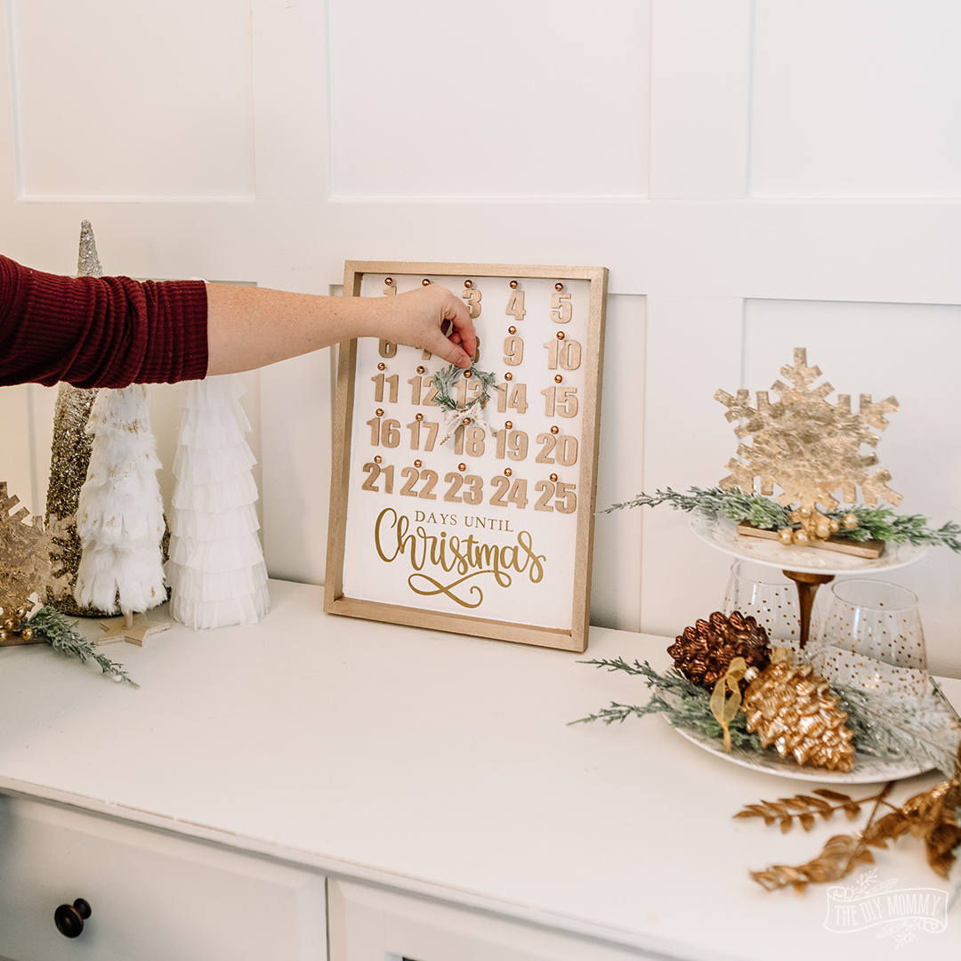Learn how to make a beautiful DIY Christmas countdown calendar with dollar store supplies