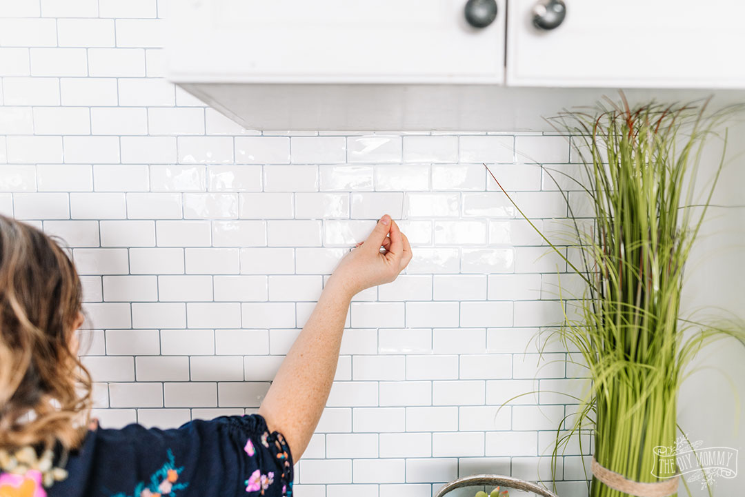 How To Install L And Stick Tile Backsplash The Diy Mommy - How To Put Tile Backsplash On Wall