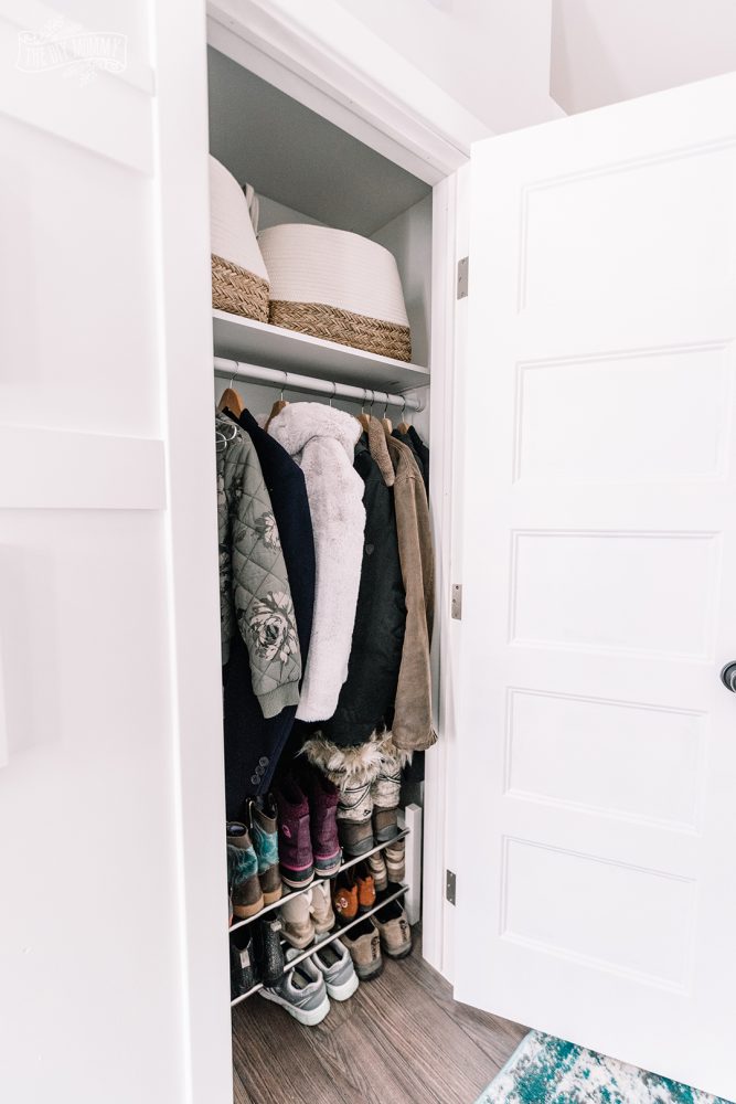 Small Entryway Makeover organized closet with baskets and shoe rack