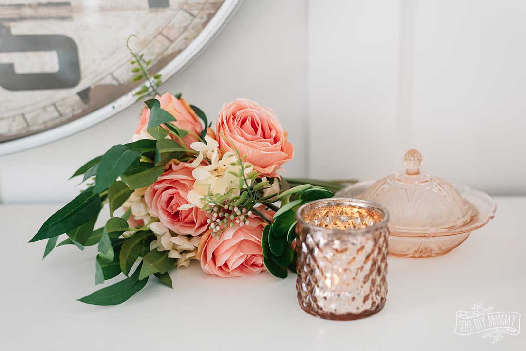 Spring / Easter tablescape idea in warm pinks, oranges, and vintage-inspired accessories.