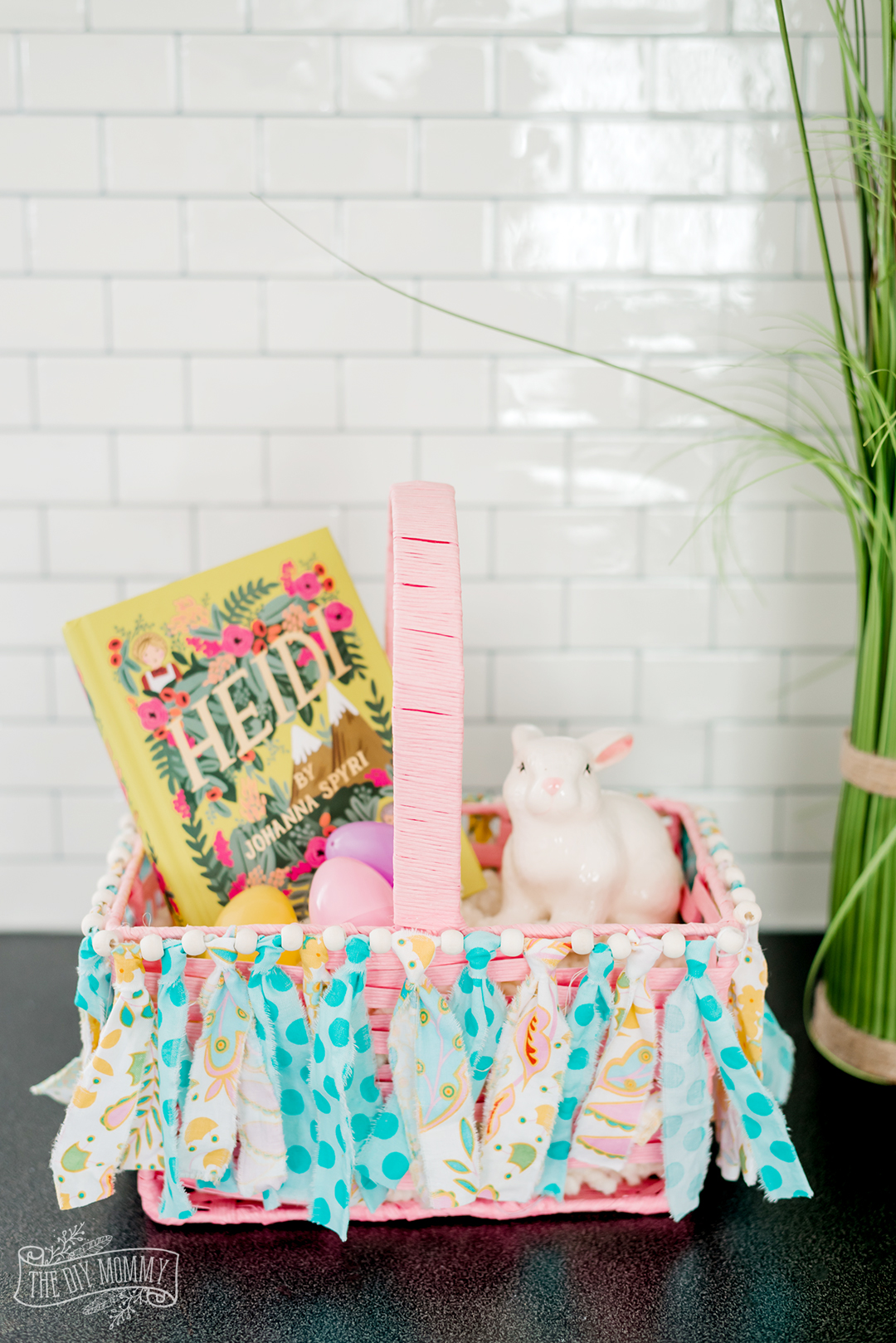 Learn how to make a DIY scrap fabric garland to decorate an Easter basket or use as wall decor