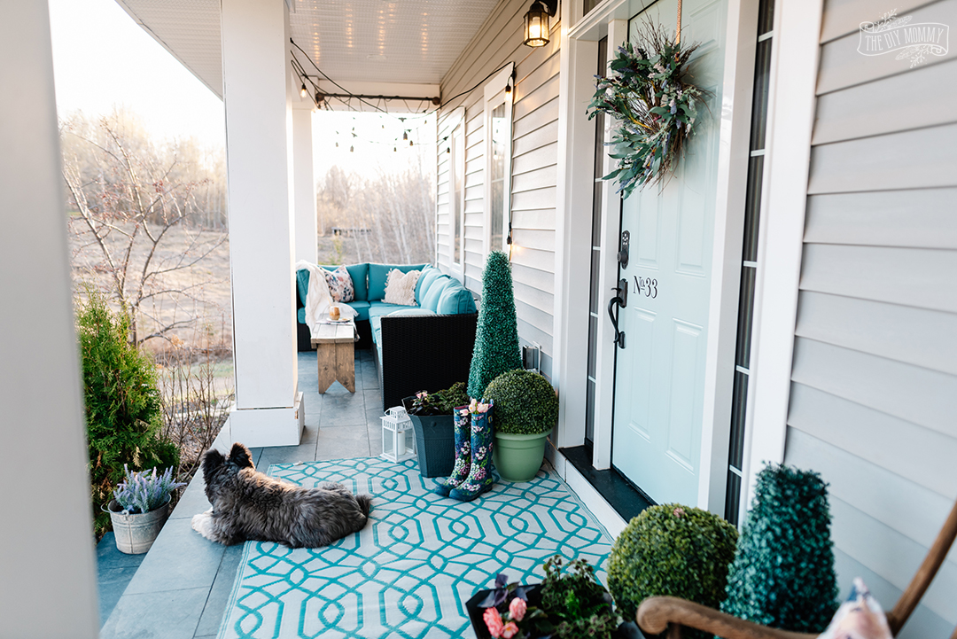 Simple ways to refresh your porch like painting a front door, using what you have on hand, cleaning and planting easy planters