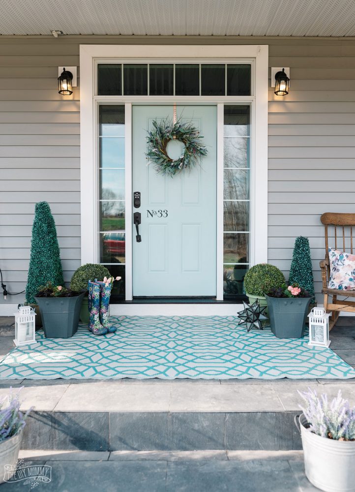 Simple ways to refresh your porch like painting a front door, using what you have on hand, cleaning and planting easy planters