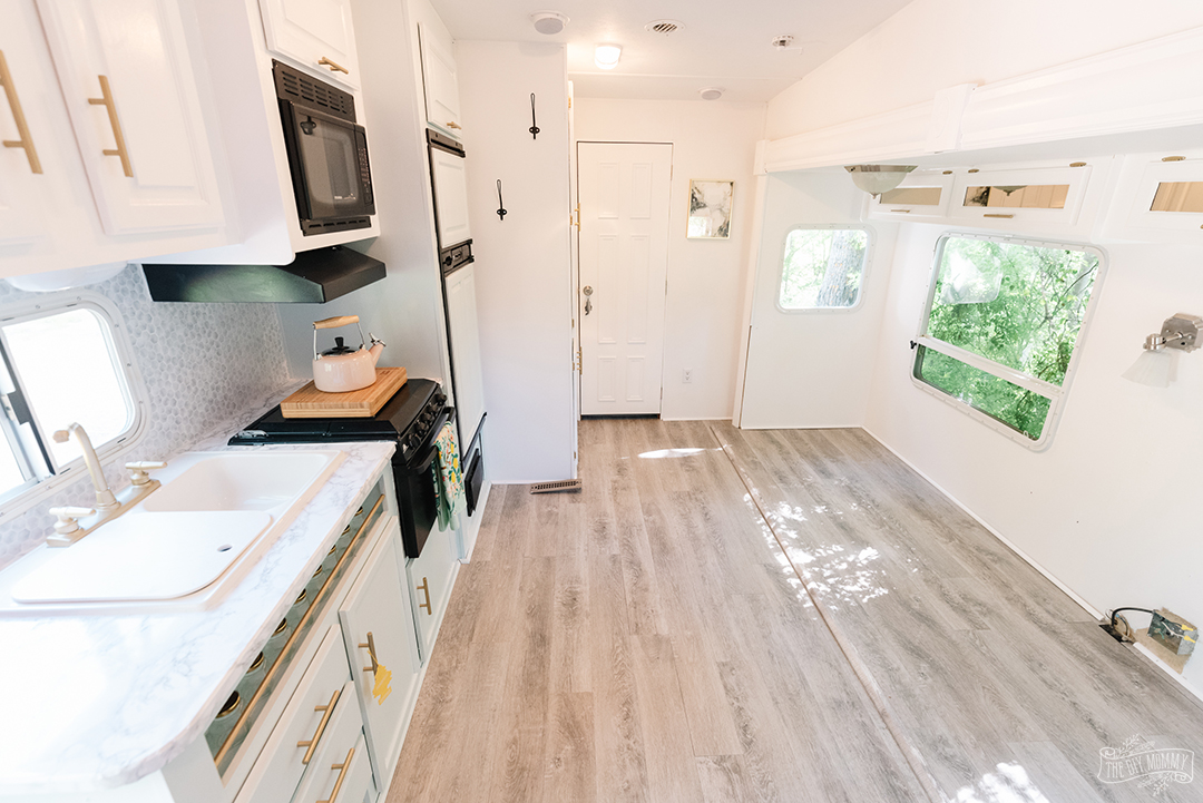 Installing Vinyl Plank In An Rv With A, Can You Install Vinyl Flooring Under Kitchen Cabinets