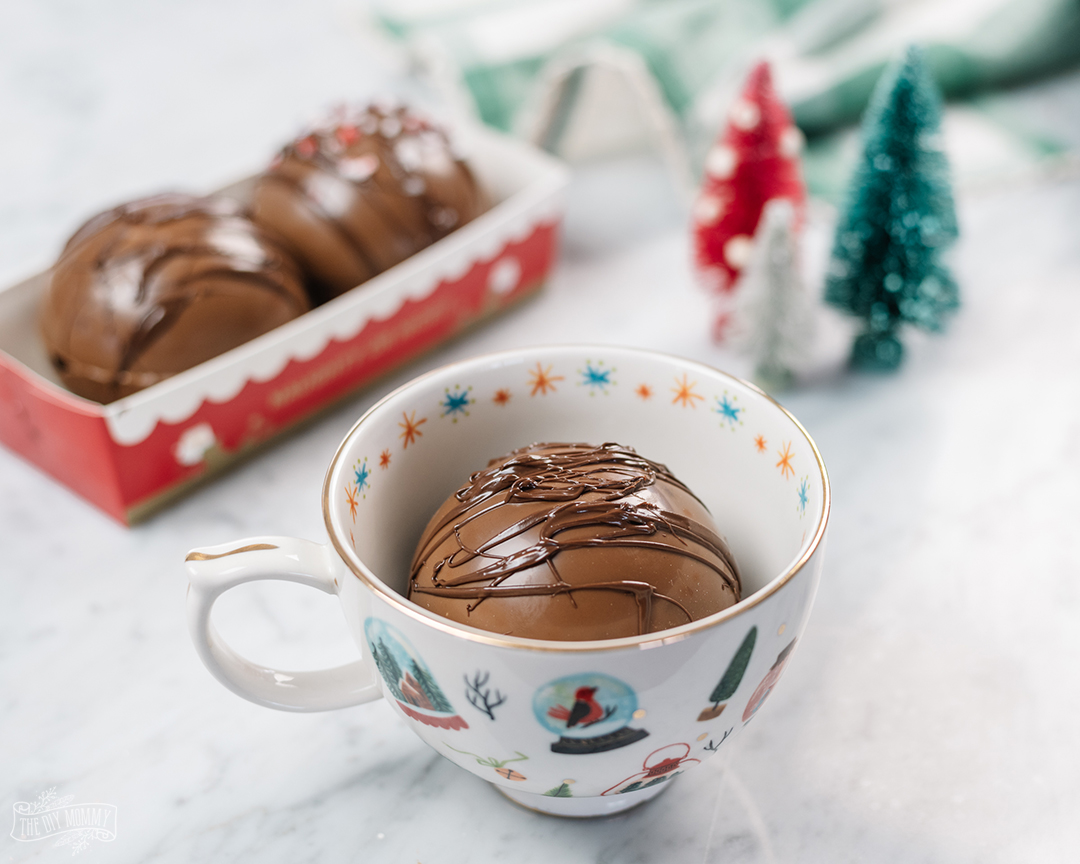 Learn how to make these amazing & fun DIY cocoa bombs. They're so easy to make, and they're a great gift!