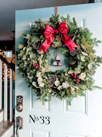 Learn how to put together a fresh greenery Christmas wreath that looks full and gorgeous with this easy wreath hack!