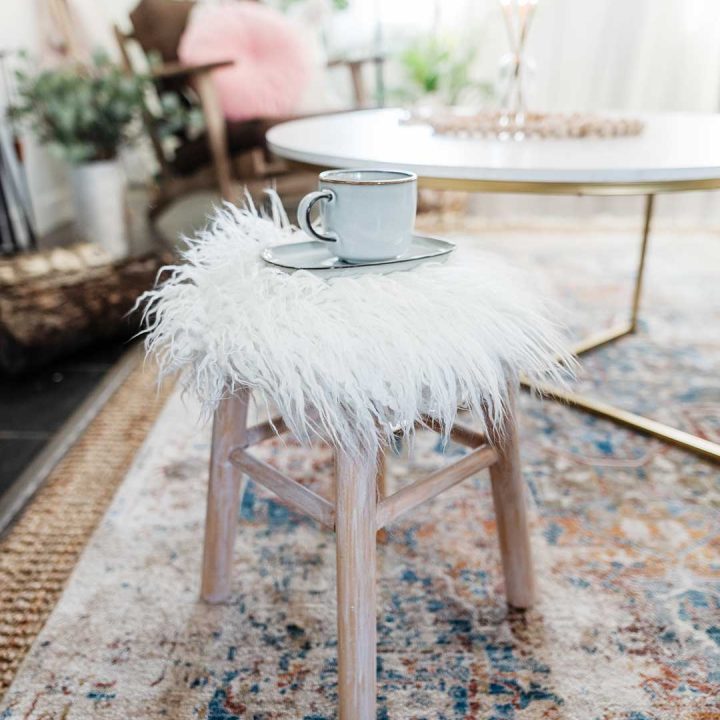 Turn a plain wooden counter stool into a cozy, Scandi inspired faux fur accent stool.