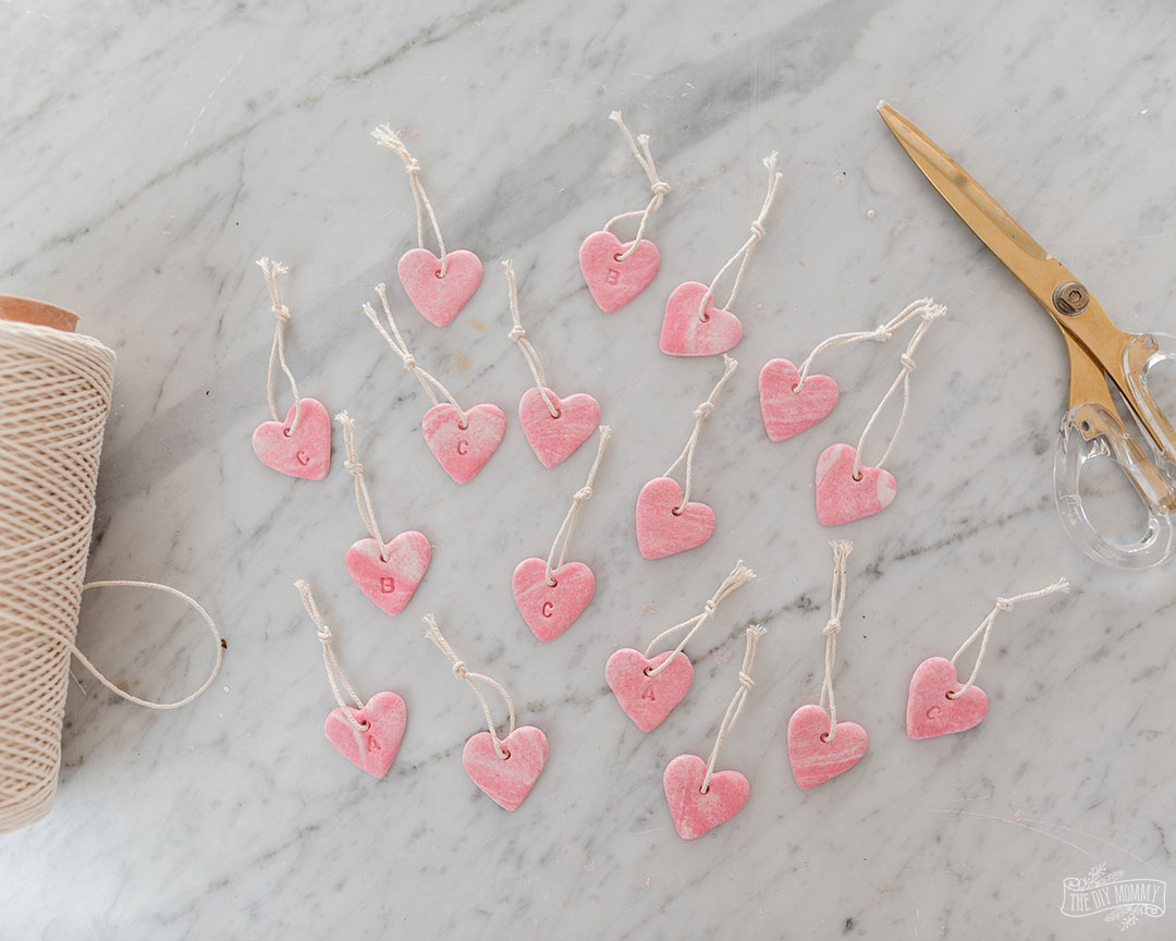 Learn how to make these simple DIY polymer clay marbled heart ornaments for Valentine's Day decor.