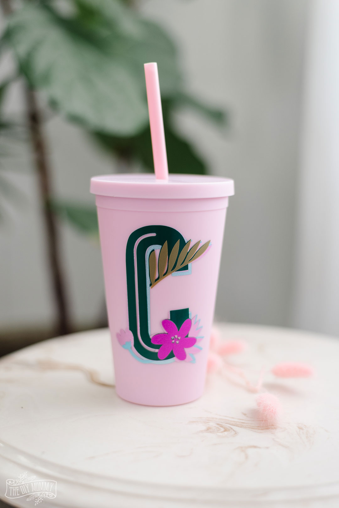DIY floral monogramed pink tumbler  made using your Cricut machine will make a great Christmas gift.