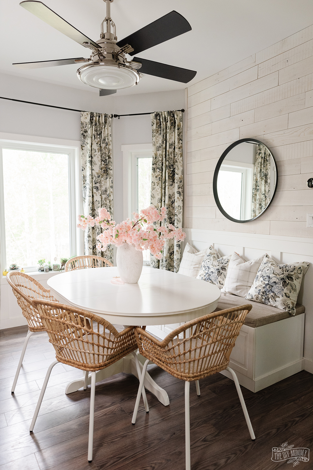 DIY curtains are hanging in a breakfast nook