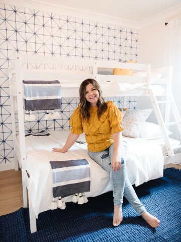 Come see how a plain, dated bedroom was transformed into a bright and cheerful bedroom with a bunk bed and blue, yellow and white colors
