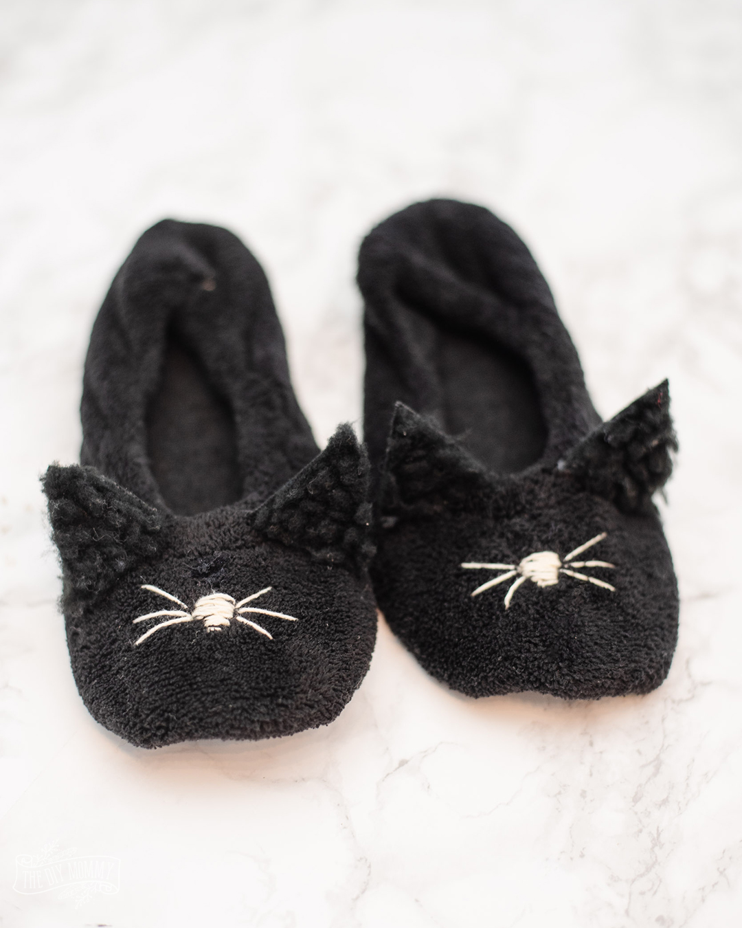 Learn how to make these cute DIY cat slippers from $3 Walmart slippers. So easy to make and an adorable gift!